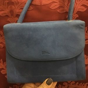 Blue suede Longchamps purse.